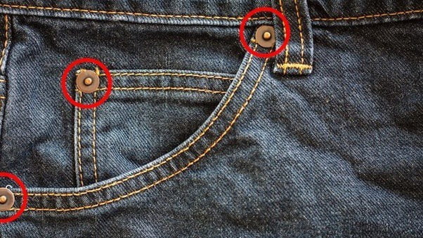 Do you know why small buttons are attached to jeans pockets